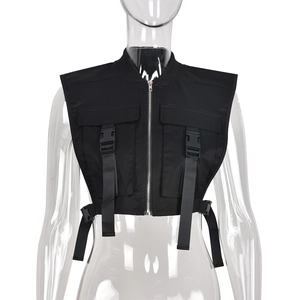 Detail of black tactical vest with functional buckles and metallic zippers on the front