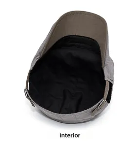 Detail view of the internal lining and adjustable metal buckle on this grey flat cap