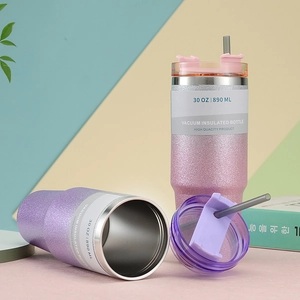 Detail of pink and purple 30oz glitter insulated tumblers with lids and straws