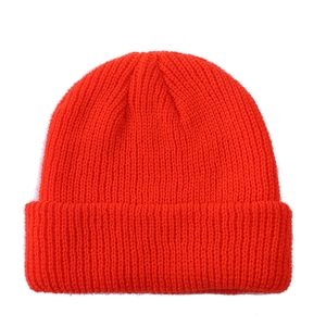 Classic bright orange knitted wool beanie for women with a warm vintage skull cap design