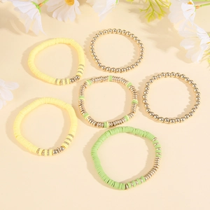 Detailed set of 6 Bohemian heishi clay bead bracelets in yellow, green, and gold colors
