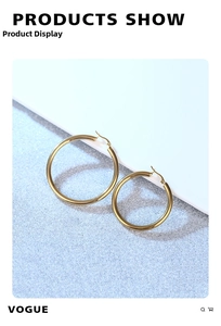 Polished hollow gold hoop earrings shown on a light blue sparkling background