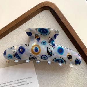 Dunkelblaue Haarklammer mit Evil Eye Muster und schimmerndem Perlmutt-Finish-Effekt