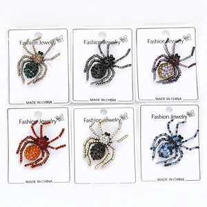 Detailed grid view of six assorted color rhinestone spider brooches on display cards