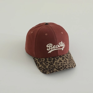 Detail of kids baseball cap featuring 3D Beooty embroidery and leopard print brim