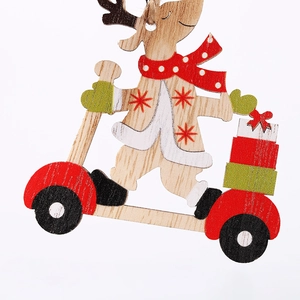 Detail of wooden reindeer ornament on scooter with gift box for Christmas tree decor