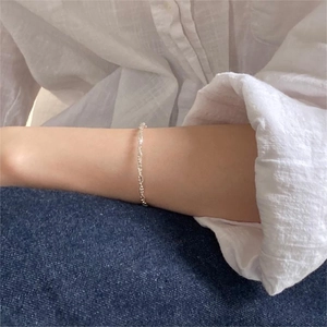 Minimalist 925 sterling silver beaded bracelet shown on model wrist in daily wear