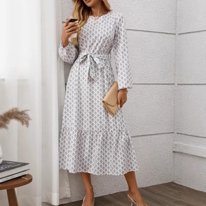 Detail of elegant gray floral print maxi dress with lantern sleeves and belted waistline