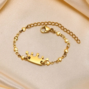 Detail of a golden crown bracelet with heart links and an adjustable extension chain