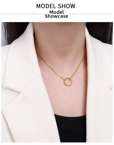 Detail of 18k gold plated double layered choker necklace with minimalist ring pendant