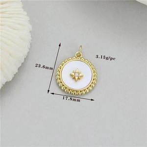 Detail of round heart shell pendant with gold star inlay and dimensions 23.6x17.8mm