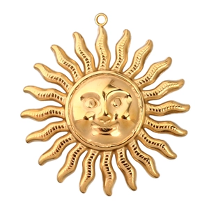 Macro shot of sun face charm in gold stainless steel for DIY jewelry making