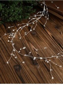 Macro view of crystal beaded garland with faceted acrylic gems on silver wire for decor