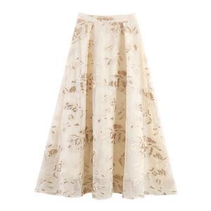 Detailed embroidery of gold sequins on a beige tulle long skirt set with floral patterns