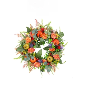 Detail of autumn wreath with orange roses, mini pumpkins, and eucalyptus leaves