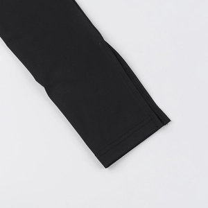 Detailed close-up of the black knitted sleeve cuff with precise stitching and high-quality fabric