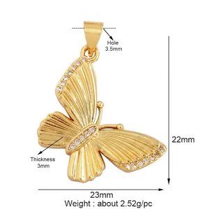 Detailed view of a gold butterfly pendant with cubic zirconia and exact dimensions