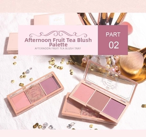 Close-up of three-color blush palette with matte textures and soft makeup brush
