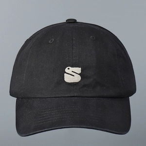 Close-up of white 3D letter S embroidery on high-quality black cotton baseball cap