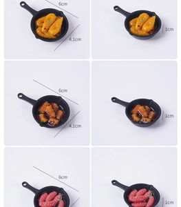 Detailed size view of miniature resin pans featuring realistic shrimp and sausage food models