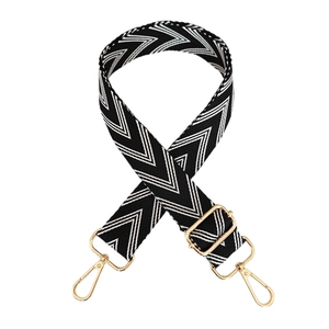 Adjustable black and white wave pattern canvas shoulder strap with gold metal hooks