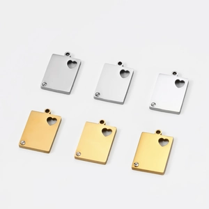 Polished stainless steel rectangular pendants with heart cutout and diamond accent