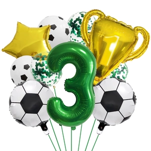 Detail view of soccer party balloons set with green number 3 and champion trophy balloon