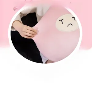 Close-up of pink plush fruit pillow showing soft texture and crying face embroidery