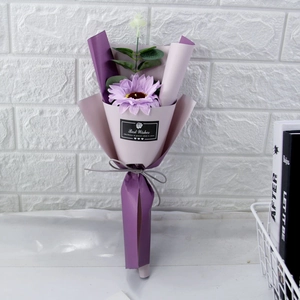 Detail of single purple soap sunflower bouquet with eucalyptus and Best Wishes tag