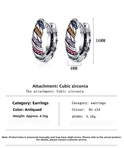 Macro view of S925 sterling silver hoop earrings with vintage finish and rainbow zircons