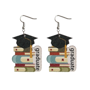 Wooden graduation theme earrings featuring colorful books and cap with graduate text