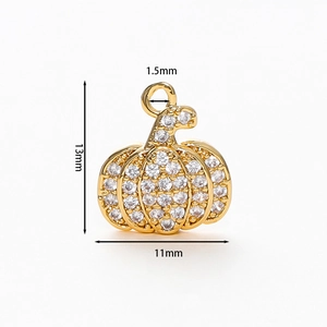 Detailed size view of a 13mm gold plated pumpkin pendant with cubic zirconia stones