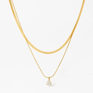 Double layered gold snake chain necklace with a pear-shaped zircon pendant