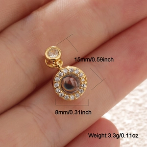 Macro detail of gold dreamcatcher pendant with 100 languages I love you stone and zircon