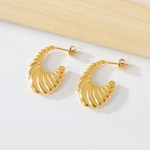 Elegant gold stainless steel croissant hoop earrings with a textured shell pattern