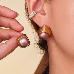 Minimalist square brown pearl stud earrings and gold rhinestone ear cuff set on model