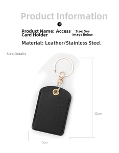 Detailed view of a black leather key card holder with stainless steel ring and spring clasp
