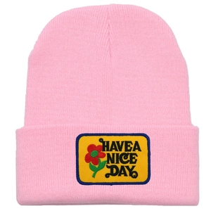 Pink rib-knit beanie for women with Have a Nice Day floral patch and warm design