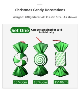 Macro detail of three 40cm green metallic Christmas candy ornaments with spiral patterns