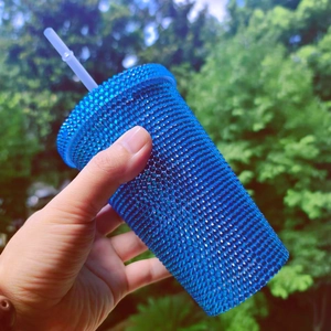 Blue double-walled studded tumbler with straw and textured diamond grid surface
