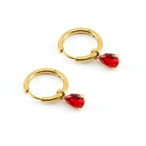 Detail of gold hoop earrings featuring elegant red teardrop-shaped zircon stones
