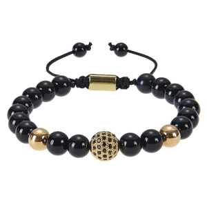 Close-up of beaded bracelet with micro-pave gold charm and adjustable braided cord