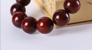 Macro shot of Argentine Green Sandalwood beads showing natural grain and rich texture