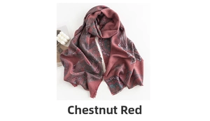 Detailed close-up of red paisley pattern on soft cashmere-like winter shawl wrap