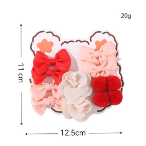 Kids hair accessory set with bows and chiffon flowers on a cute bear card display