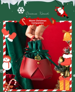 Detail of red leather Christmas apple gift bag with green velvet liner and gold tag