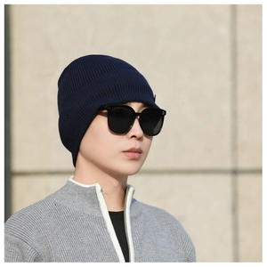 Close-up of navy blue ribbed knit beanie with high-elastic texture for winter warmth