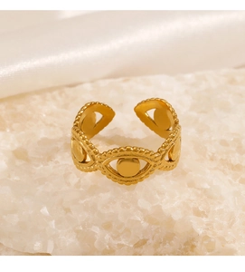 Detail of 18K gold plated adjustable ring featuring evil eye motifs on white stones