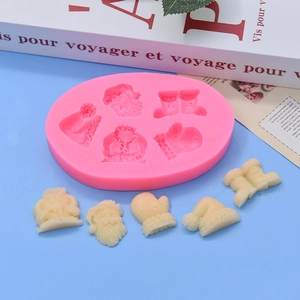 Detailed Christmas silicone mold featuring Santa, gloves, and boots for DIY baking