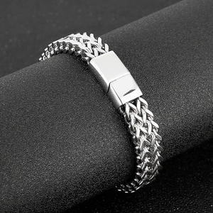 Detail of woven wheat chain stainless steel men's bracelet with rectangular clasp
